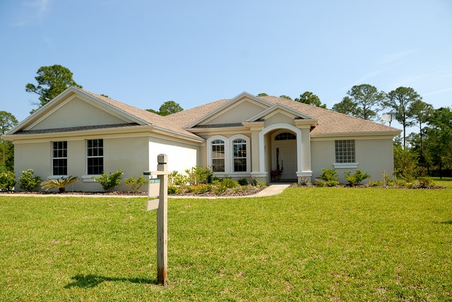 A house with a for sale sign