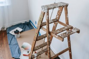 A wooden ladder covered in white paint.