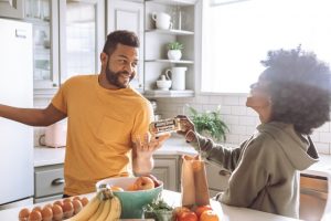 Two happy people in a kitchen