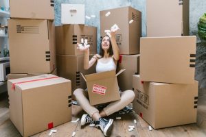 A woman packing boxes for a move