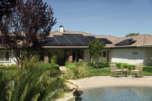 Black solar panels on brown roof